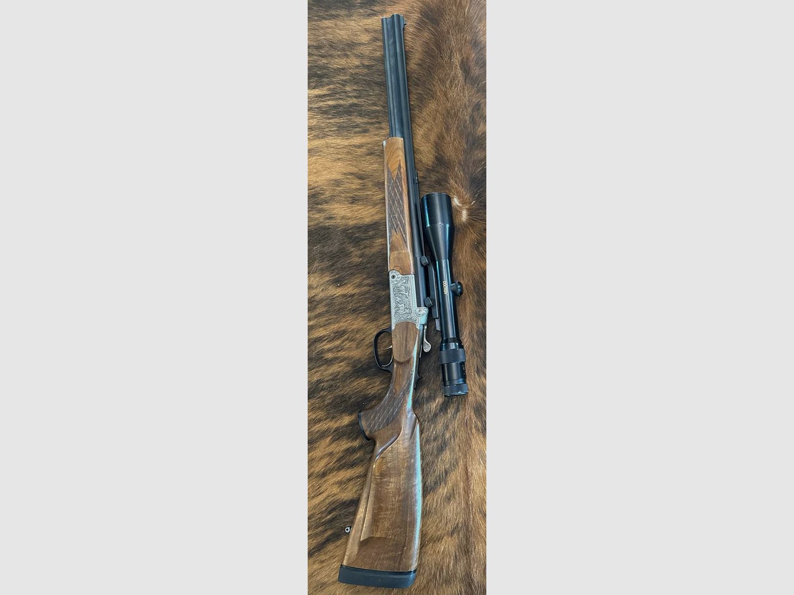Blaser Bockbüchsflinte BBF 95, 5,6x50R Magnum + 16/70 con telescopio Docter 2,5-10x48 M