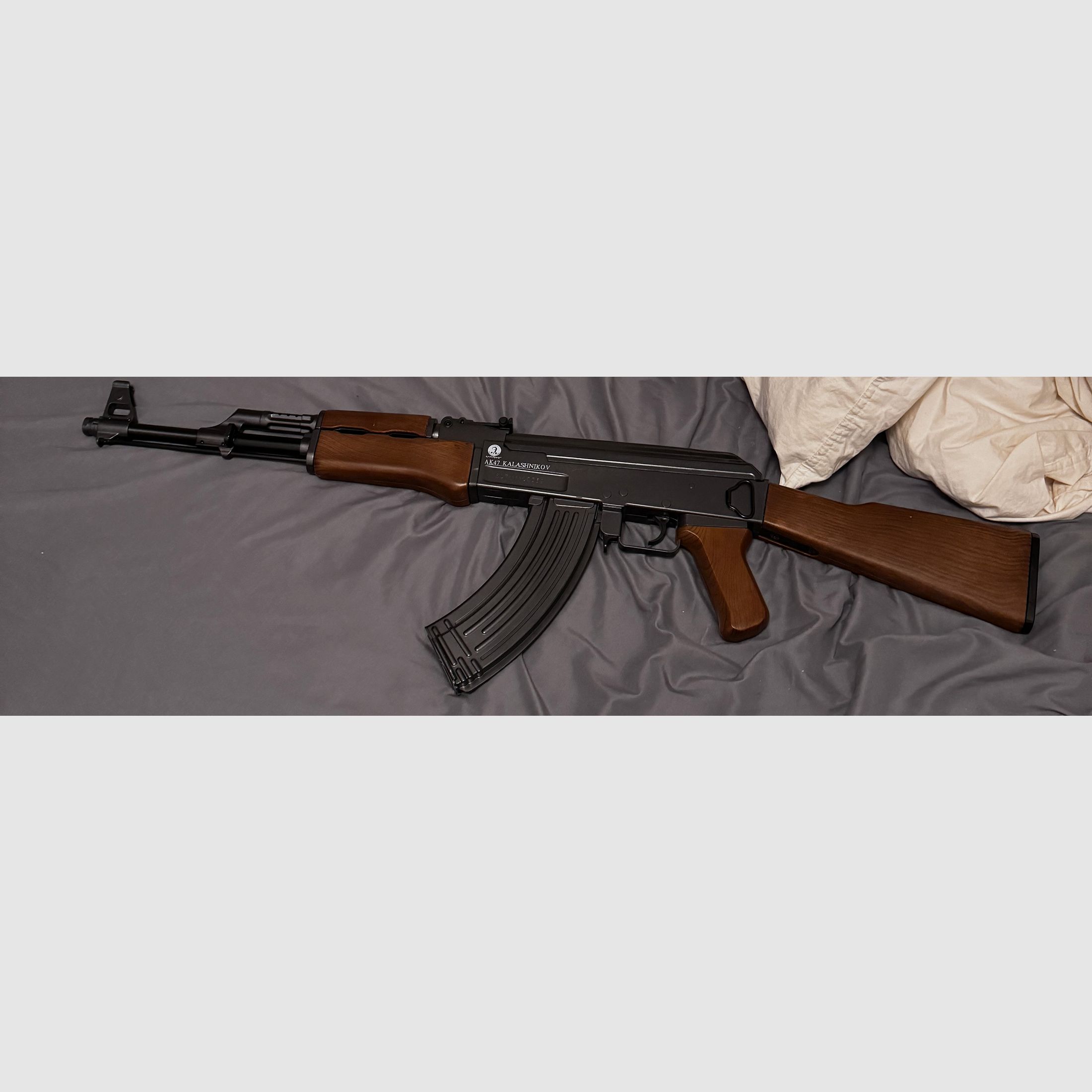 I am offering a realistic replica of an AK-47 for sale.