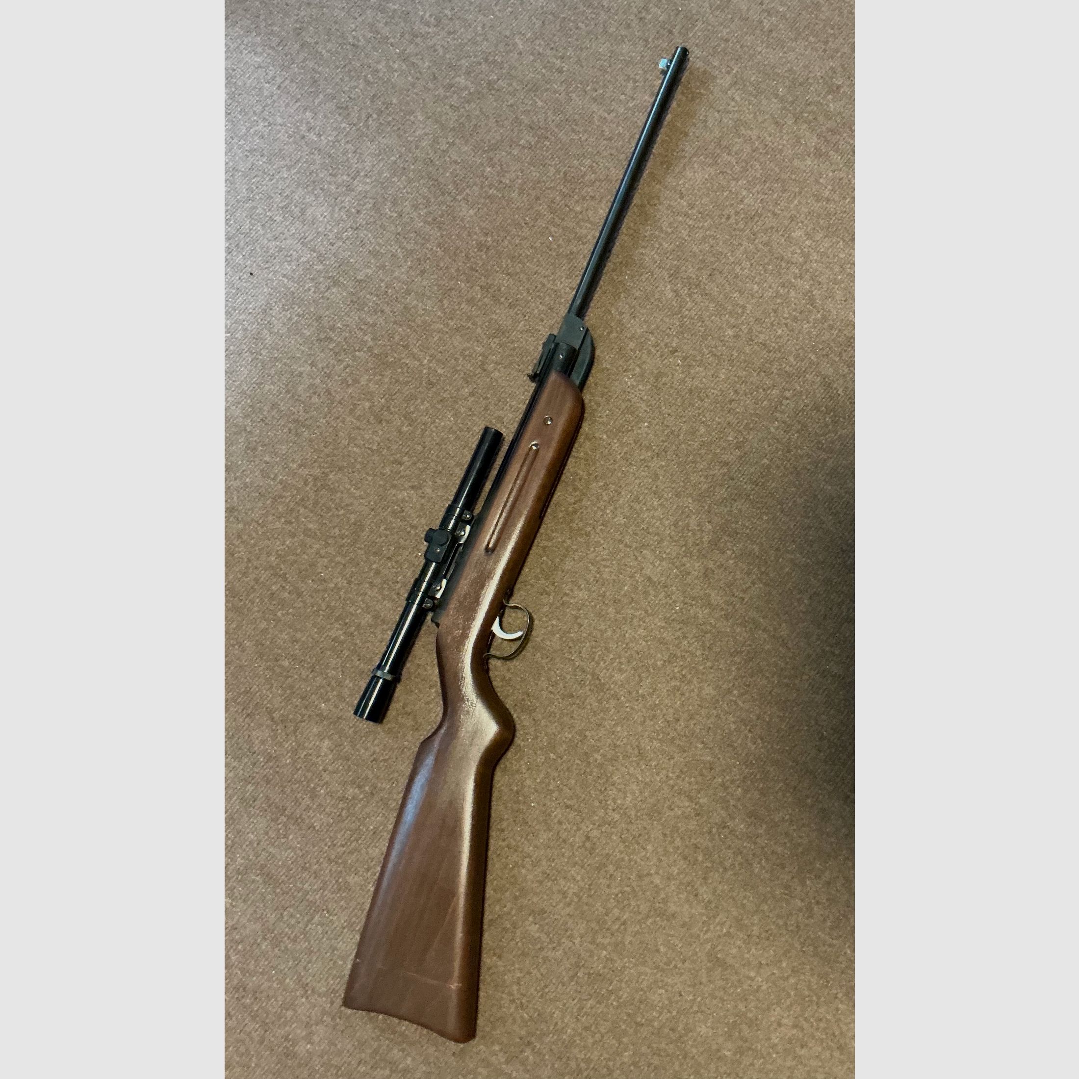 Air rifle with scope
