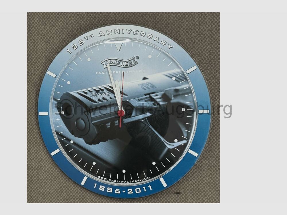 125 años de reloj de pared Walther con funda protectora