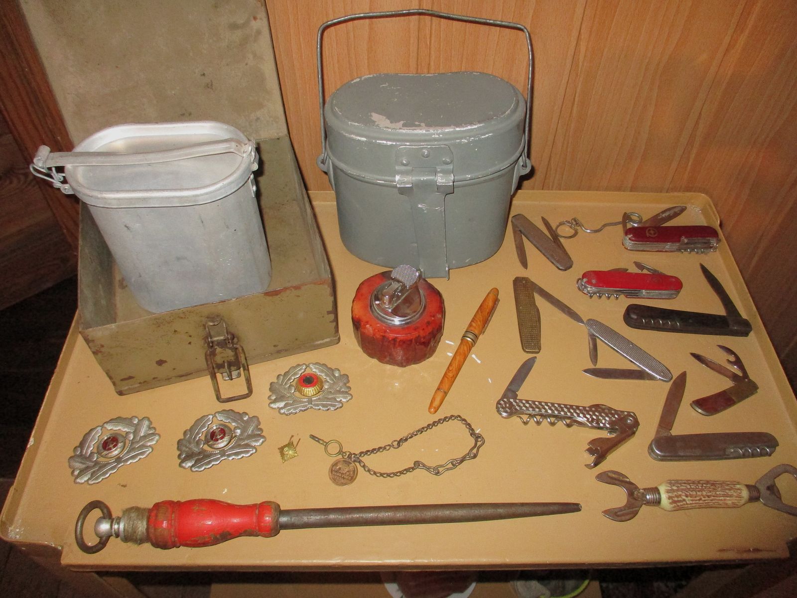 Swiss army knife, among other things, old metal ammunition box, medal on chain, among other things, military