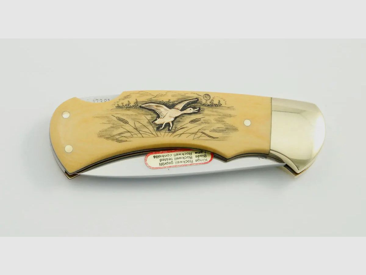 (Rarities) Puma 4-Star 715 with brass inlays duck and pheasant, warranty card, 1983