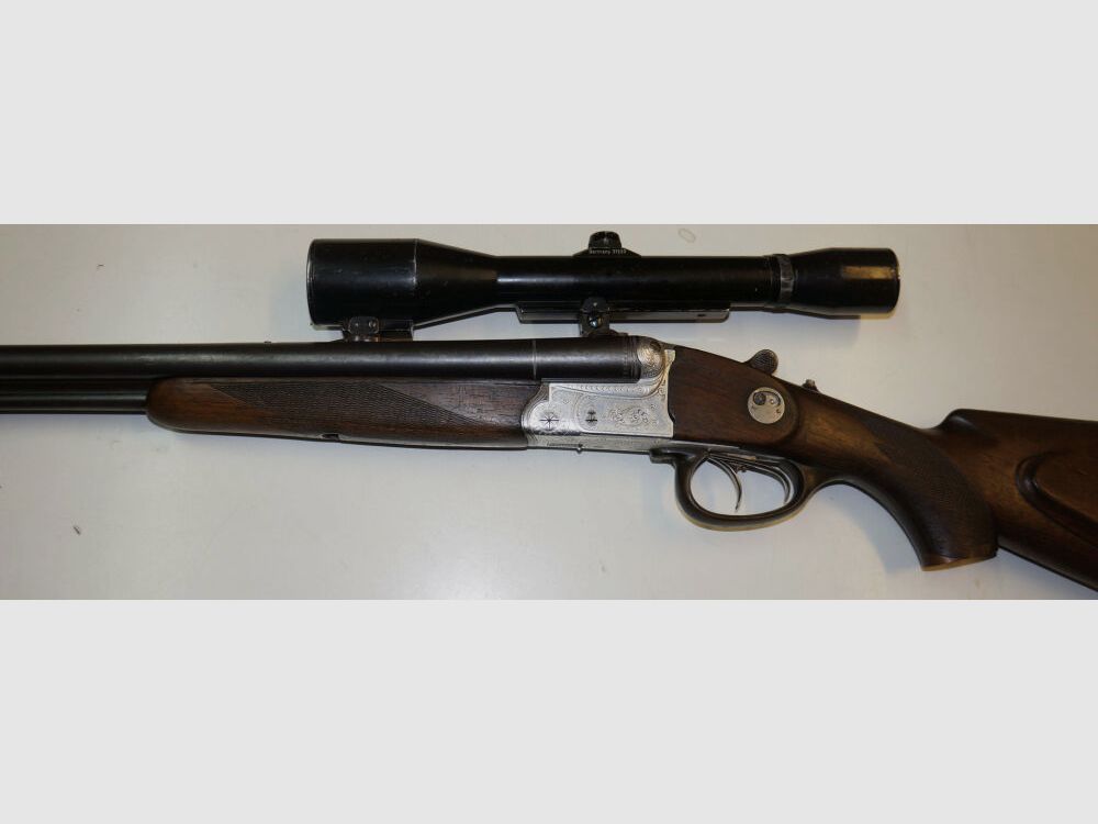 Krieghoff Drilling, Krieghoff, Kal.7x57R / Kal.16/70, mit GECO Zielfernrohr und schönen Gravuren