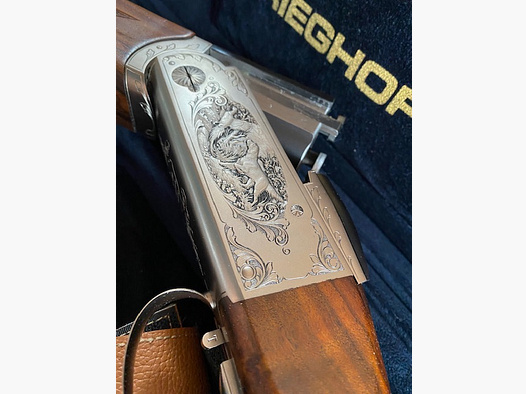 Krieghoff K80 Sporting mit sehr schöner Gravur, Top Zustand , wie neu. original Koffer und Titanchokes ausgerüstet