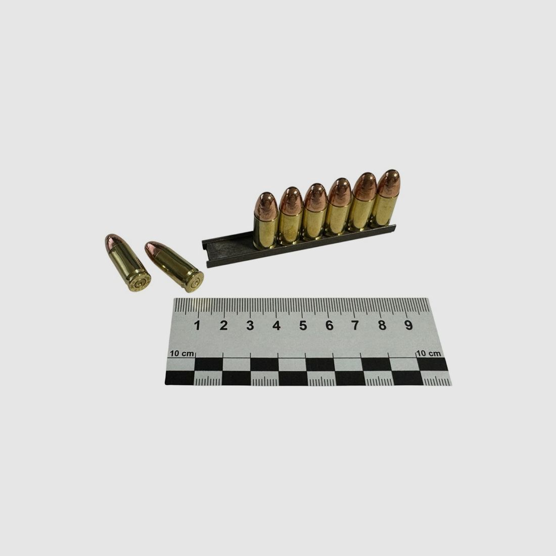 8 pieces of decommissioned 9x19 / 9mm Para VM on loading strips