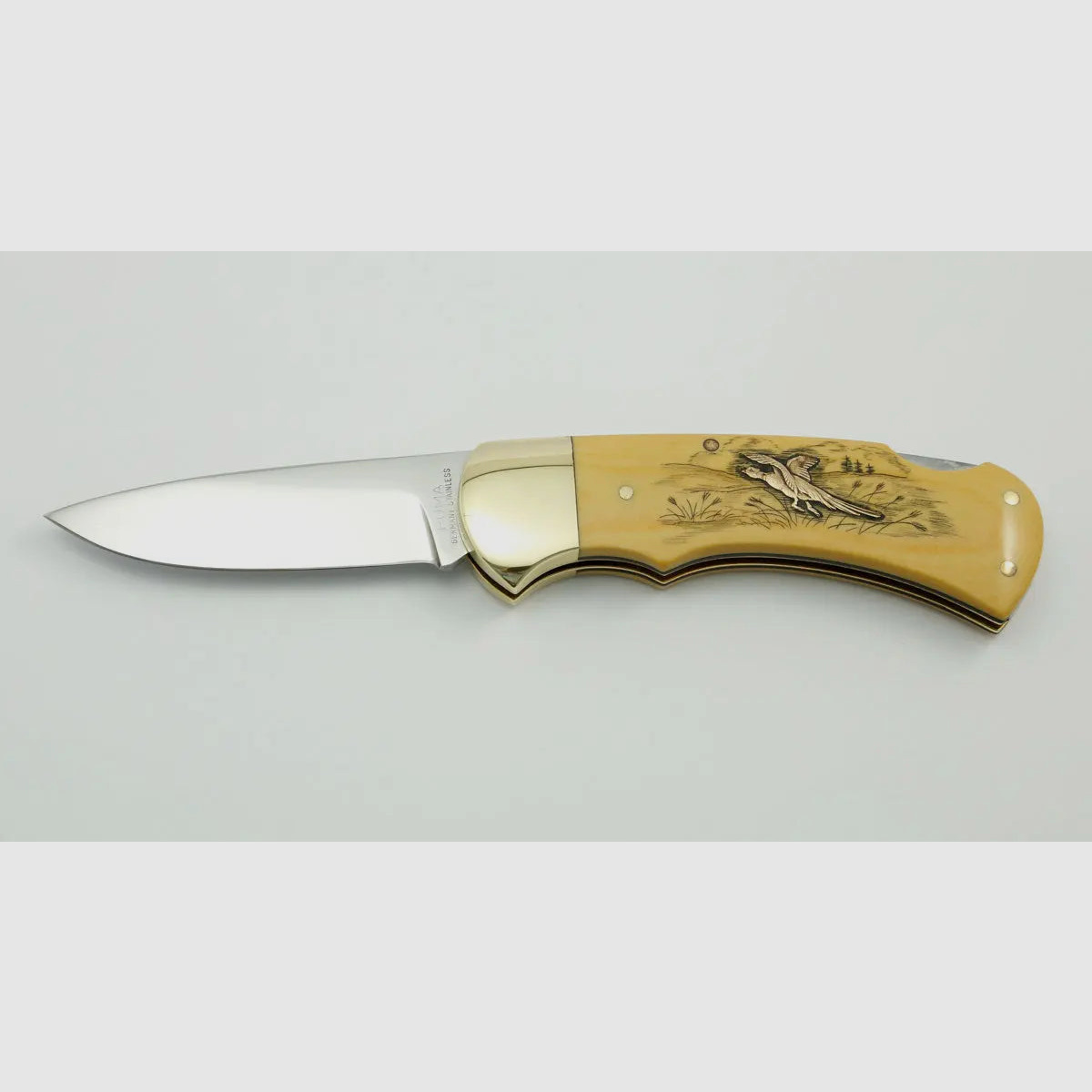 (Rarities) Puma 4-Star 715 with brass inlays duck and pheasant, warranty card, 1983
