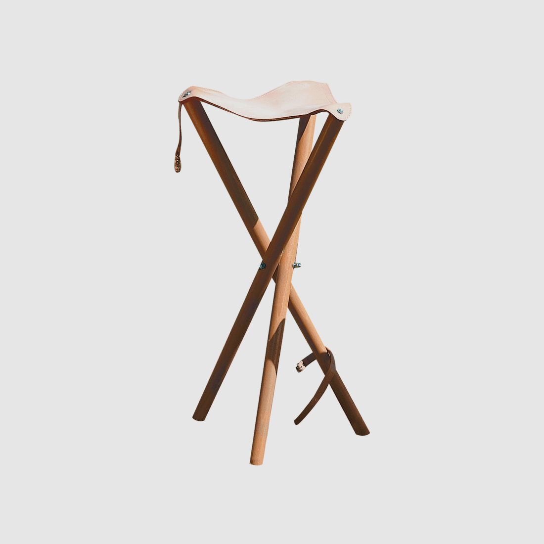 Three-legged stool with leather seat surface