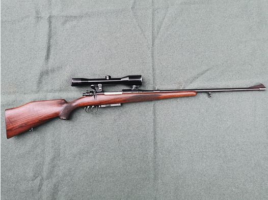 Rifle repetidora 7x57 con mira telescópica Noris