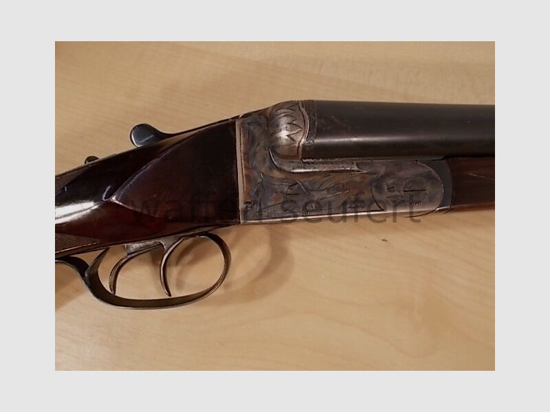 Forest double-barreled shotgun colored and engraved
