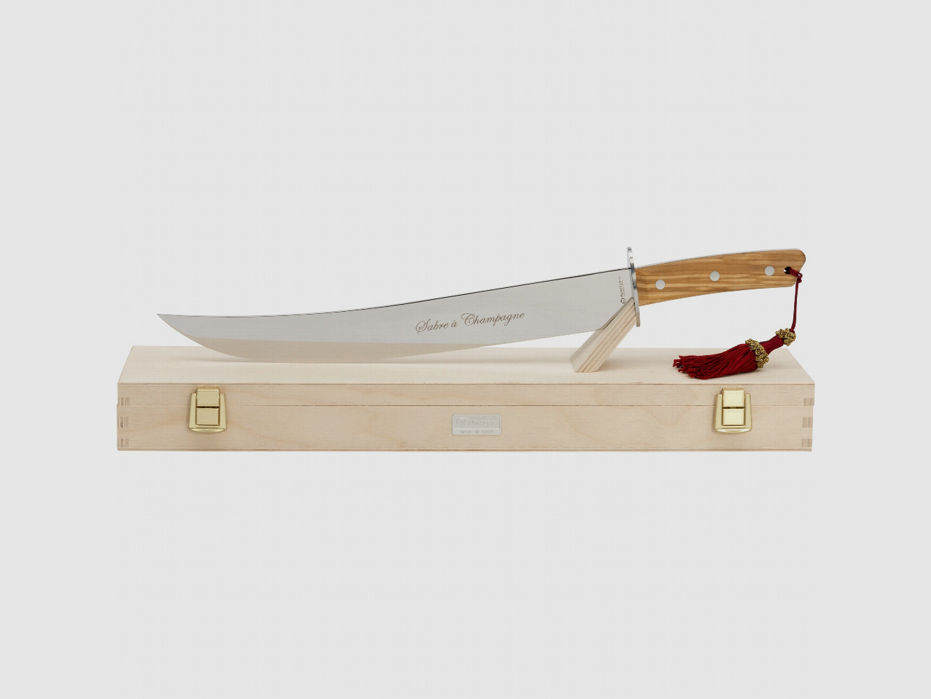 Sable de champán con mango de madera de olivo