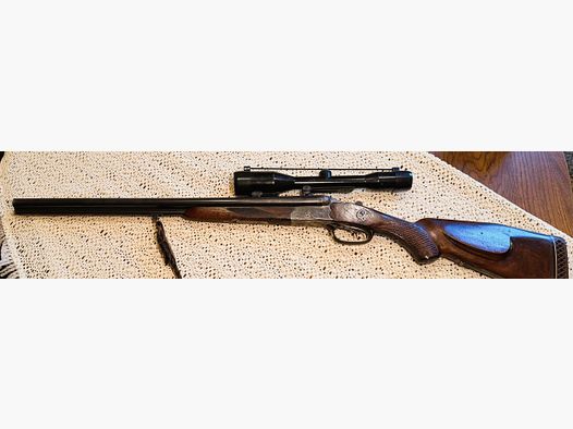 Sauer & Sohn wiercenie z delikatnymi grawerunkami, 7x65R i 2x16, wytłaczacz, długość lufy 60 cm, z wkładką Krieghoff o długości 44 cm kal. .22 Magnum, magazynek w kolbie na 4 x 65R, długość kolby 38,5 cm,