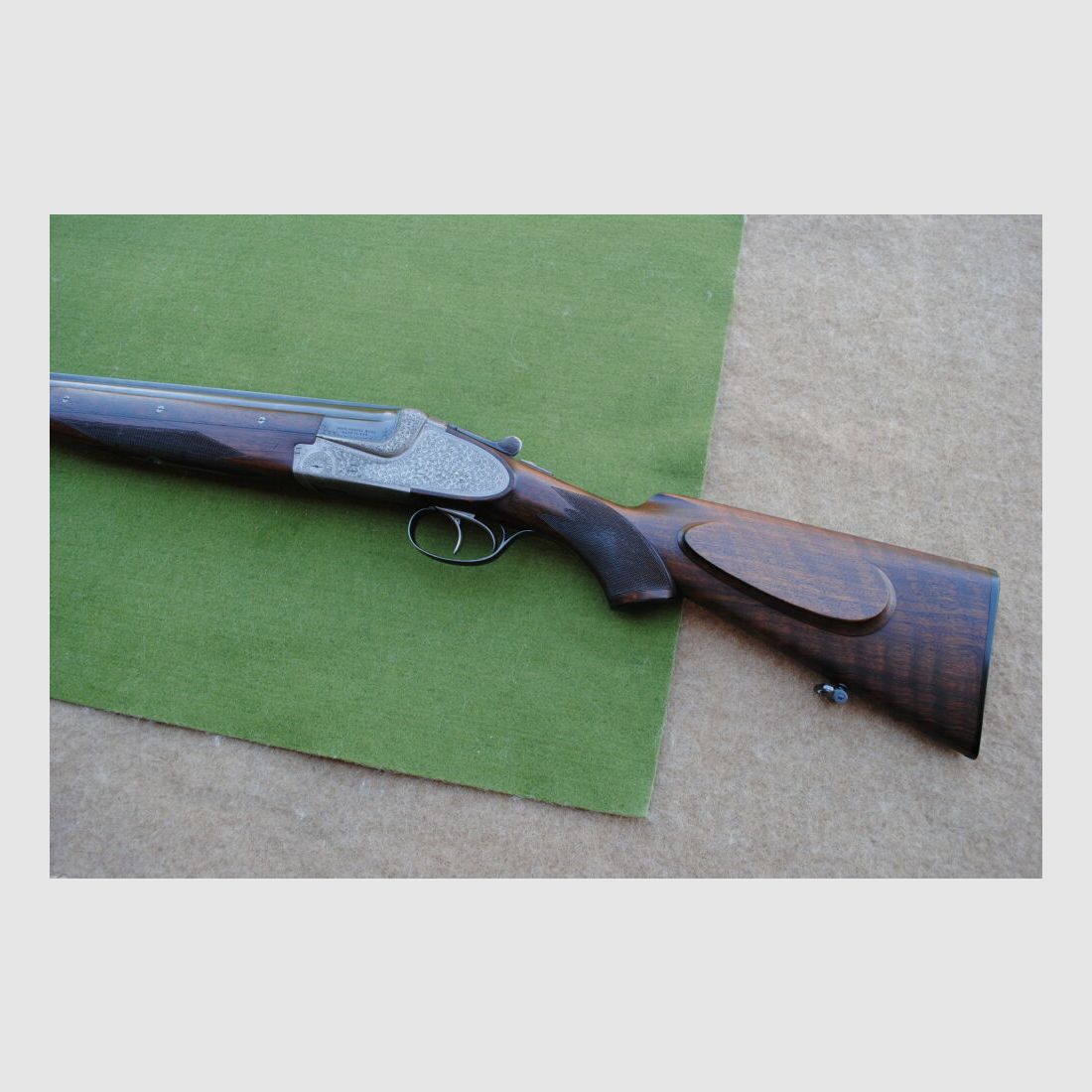 hand-engraved Merkel side lock double barrel shotgun, model 203E