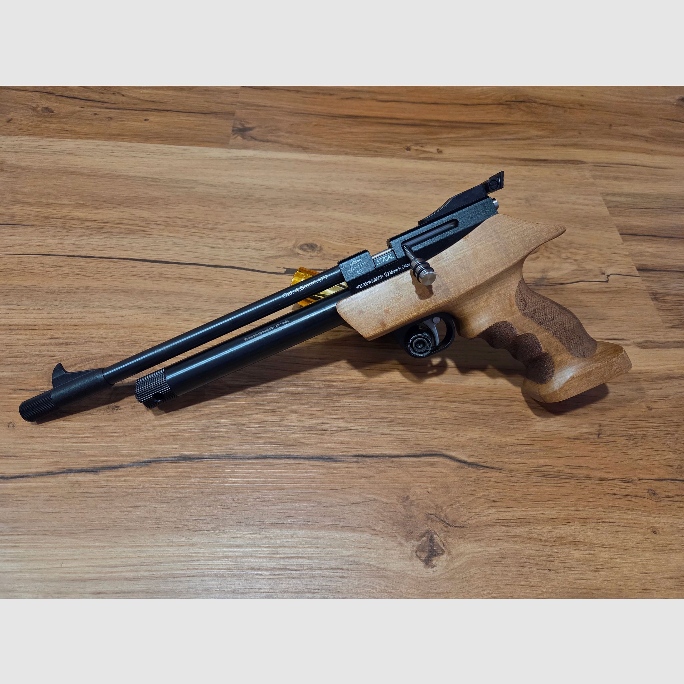 Diana Chaser with wooden handle and a pack of diabolos