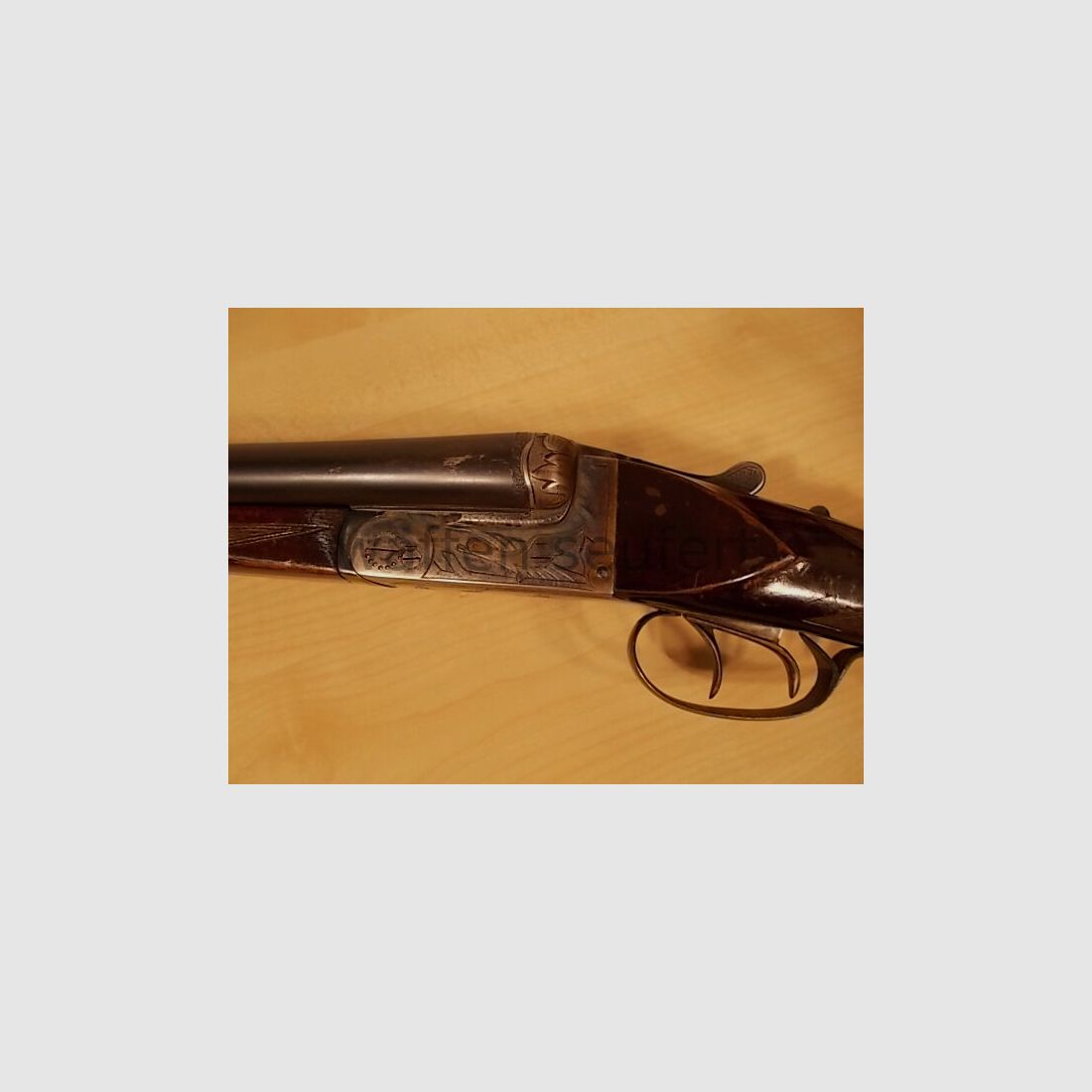 Forest double-barreled shotgun colored and engraved
