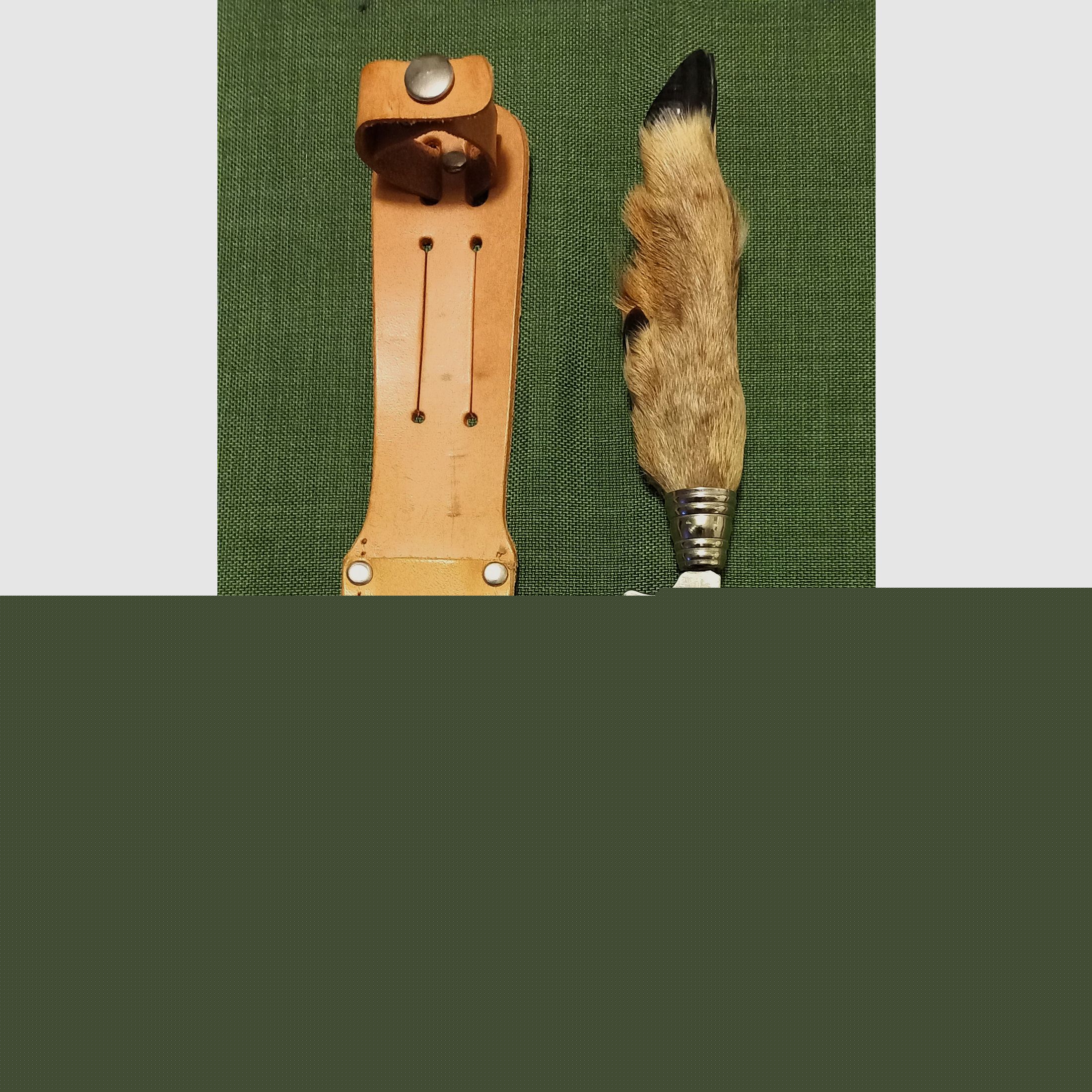 Traditional hunting knife with deer foot handle