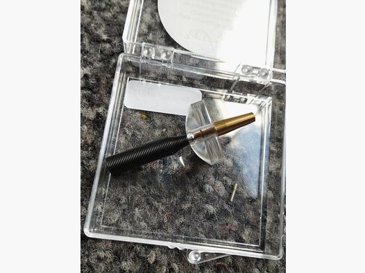Unused bullet hole tester with magnifying glass