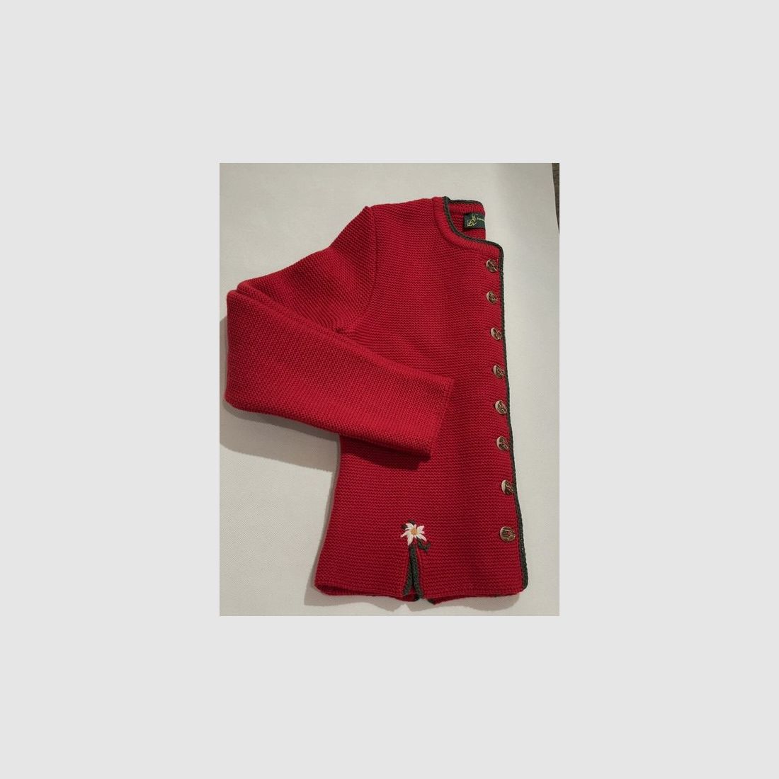 Cardigan da donna in lana merino rossa con edelweiss