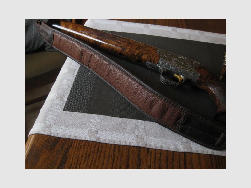 Absolutely UNIQUE COLLECTOR'S ITEM = Almost like new "Custom STEEL SYSTEM completion" with HAND-MODELED FULL ENGRAVINGS for R93, with custom-made right-handed semiweight stock and Category-11!! System is still one WITHOUT serial number!! Includes Blaser leather rifle sling!, image 1 of 17
