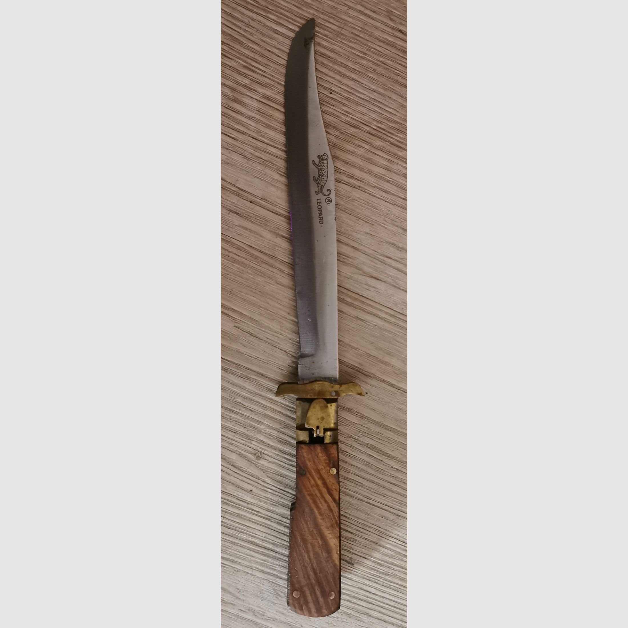 Coltello a serramanico leopardato antico