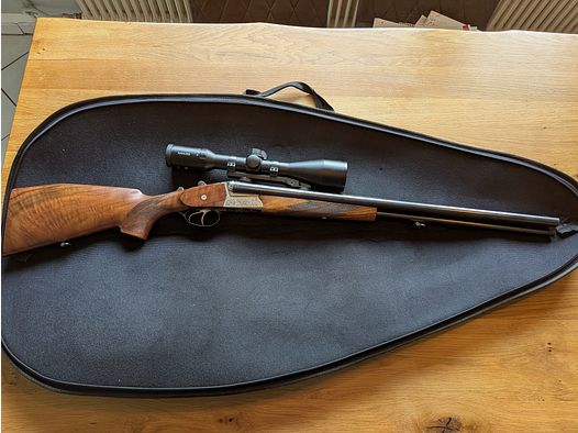 Krieghoff Trumpf (16/70, 16/70, 7x57R) y Kahles Helia 2,4-12x56i