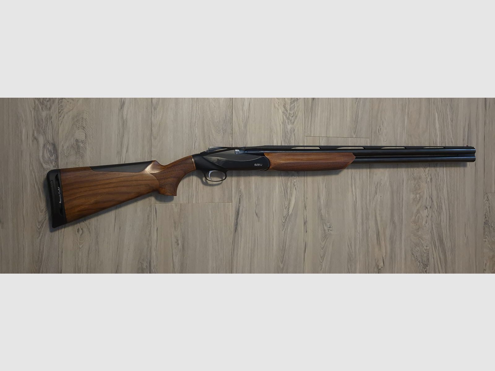 Benelli 828U Black over-and-under shotgun caliber 12/76