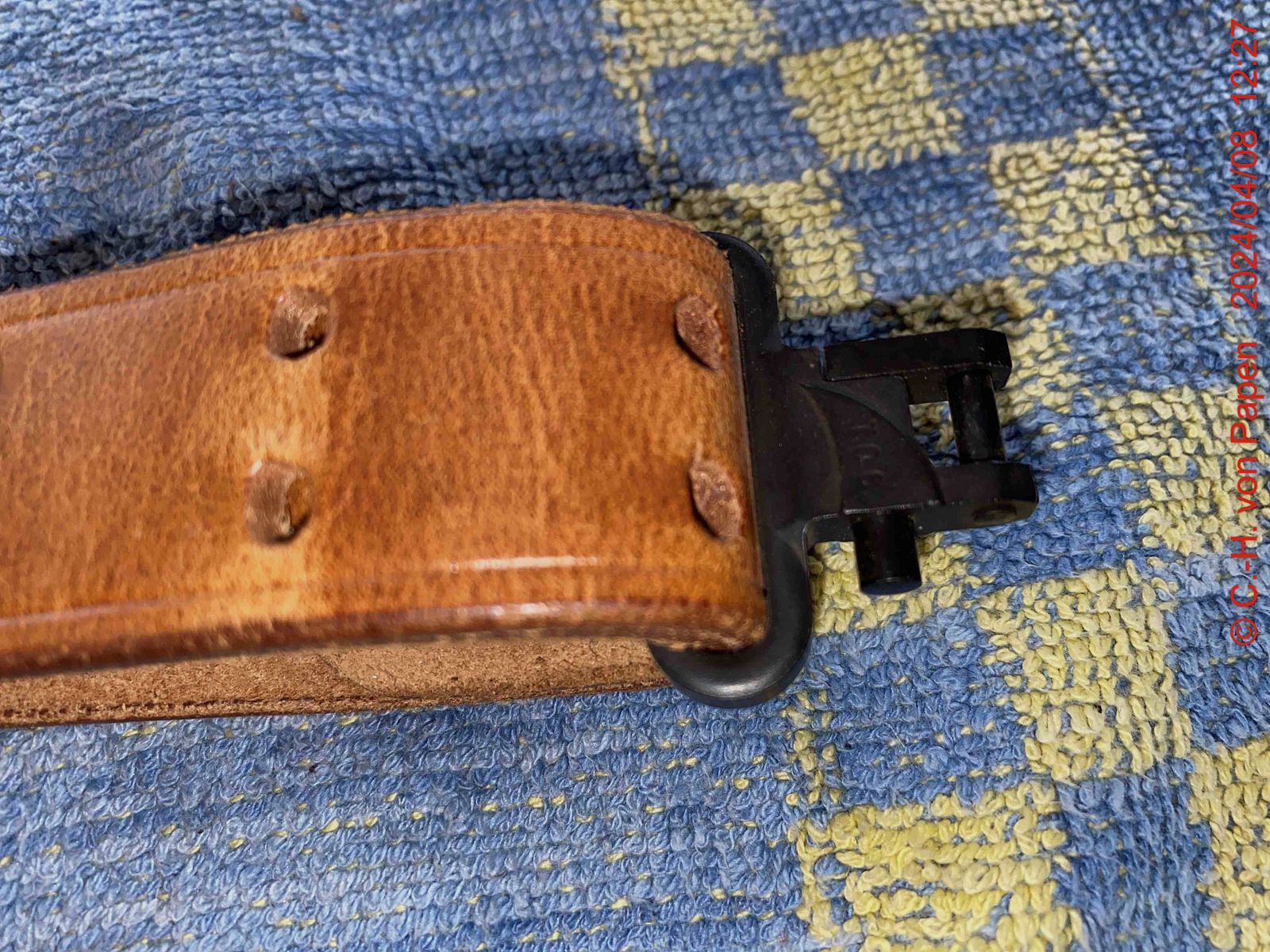 Rifle sling with strap buckle