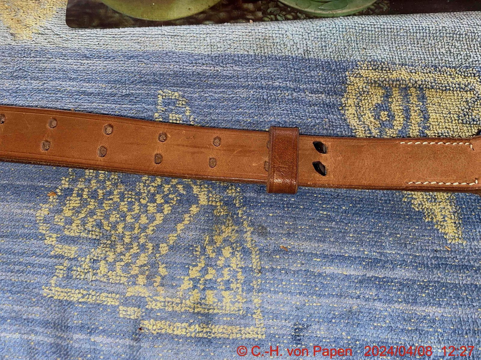 Rifle sling with strap buckle