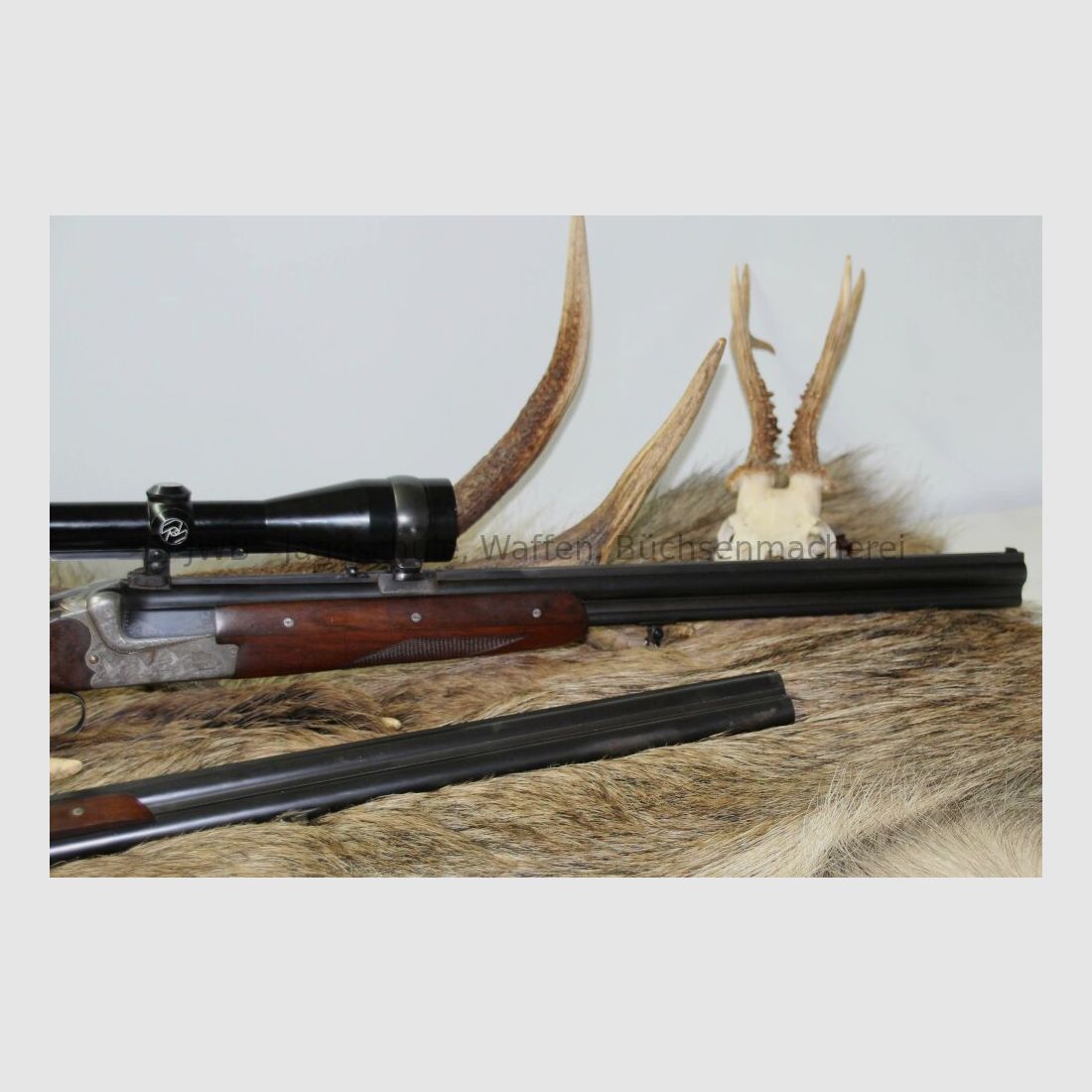 Merkel double-barreled shotgun with interchangeable double-barrel and variable sight 12/70; 7x57R