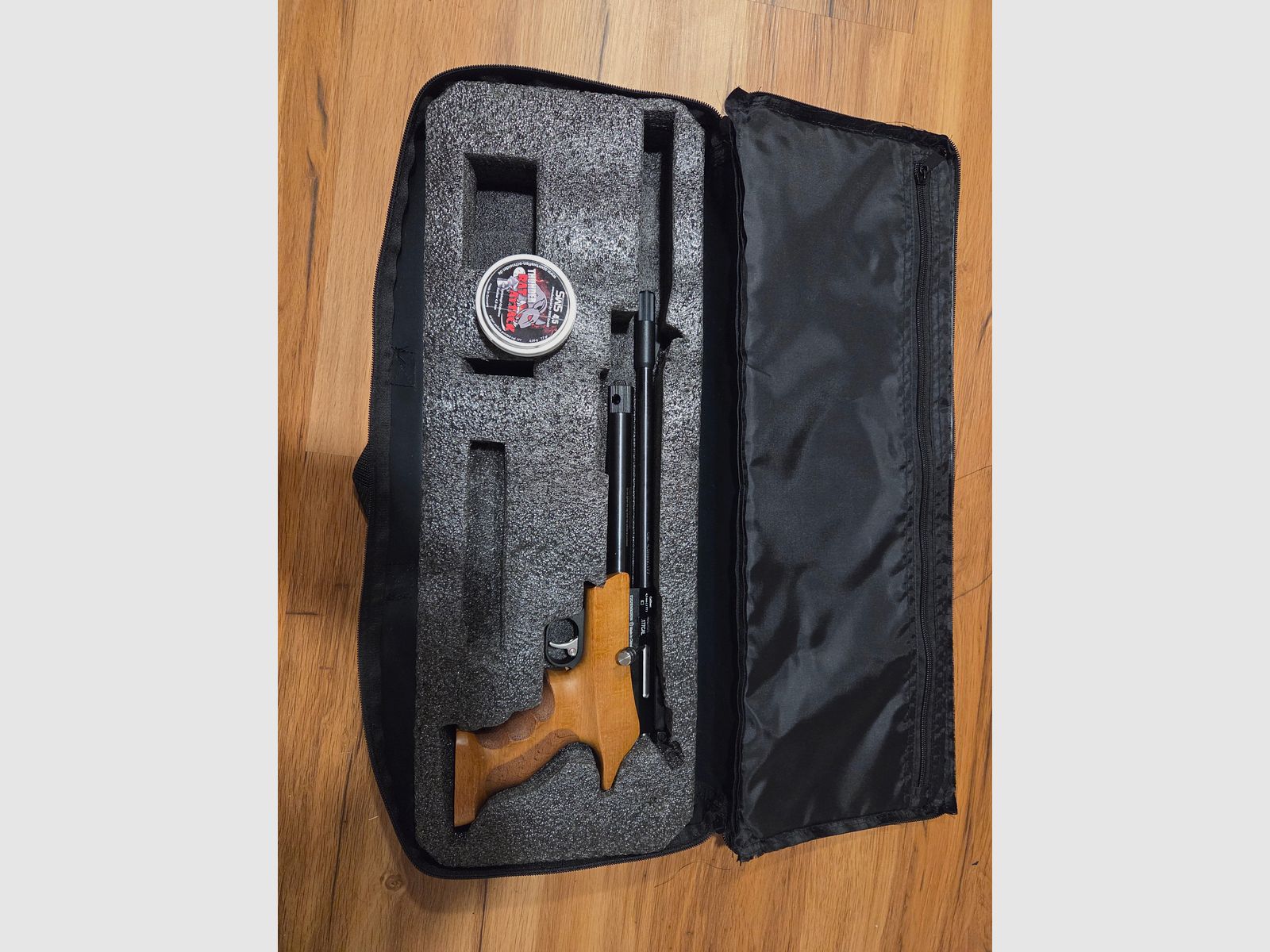 Diana Chaser with wooden handle and a pack of diabolos