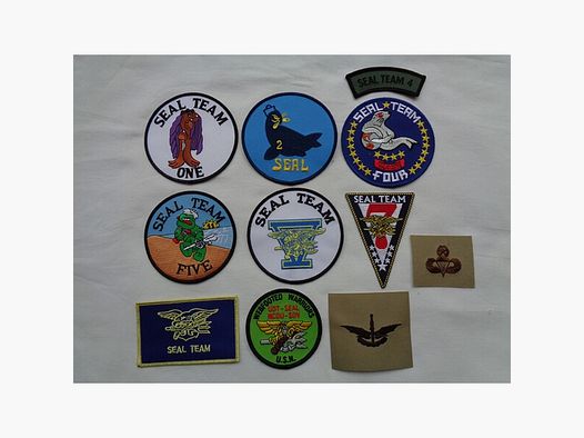 Sammlung orig. US-NAVY SEAL Abzeichen, 11 Teile, neu (NOS)