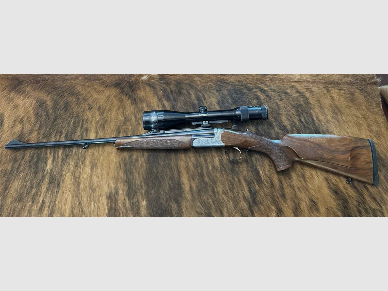 SABATTI SKL 98 DL rifle de un solo tiro de cerrojo calibre 6,5x57R con óptica de mira Docter 2,5-10x48, retícula 4