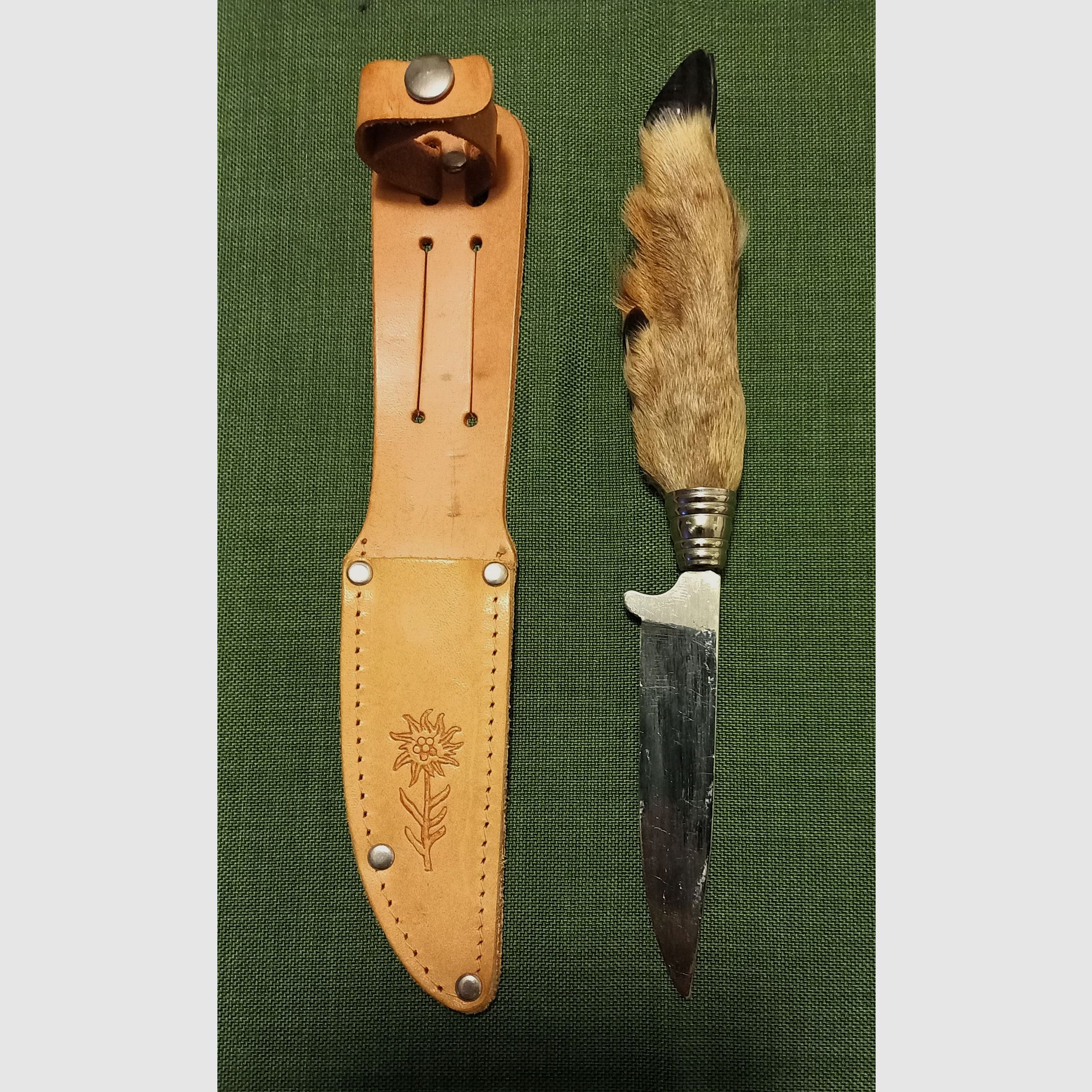 Traditional hunting knife with deer foot handle