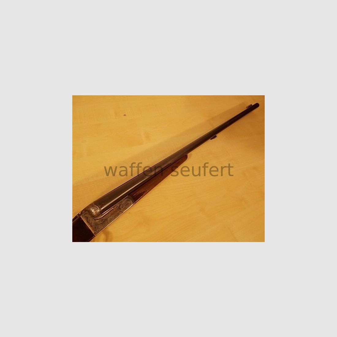 Forest double-barreled shotgun colored and engraved