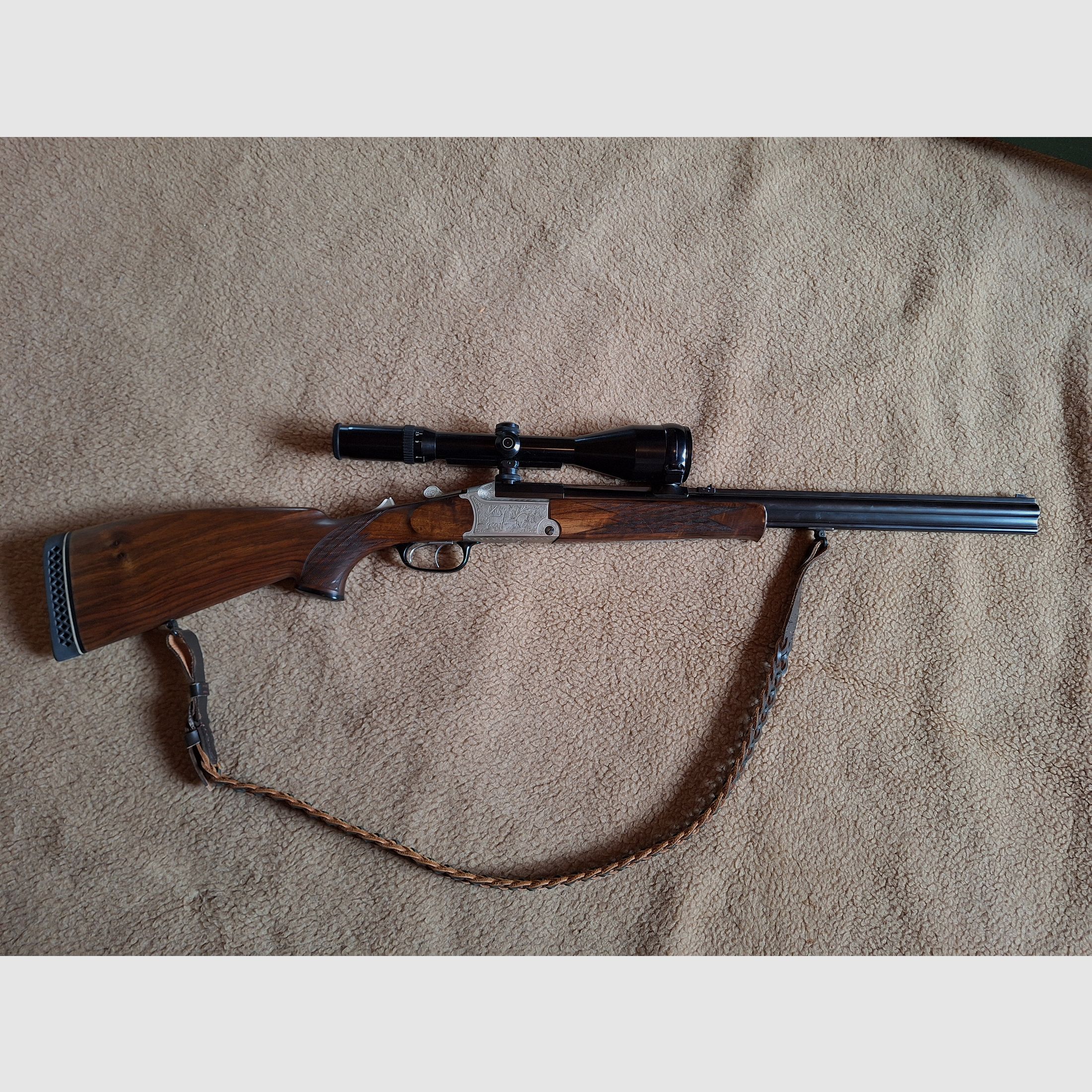 Escopeta combinada de Blaser, modelo BBF 700/88, calibre 12/70 cañón de escopeta, .30-06 cañón de rifle, visor Schmidt & Bender 2,5 - 10x