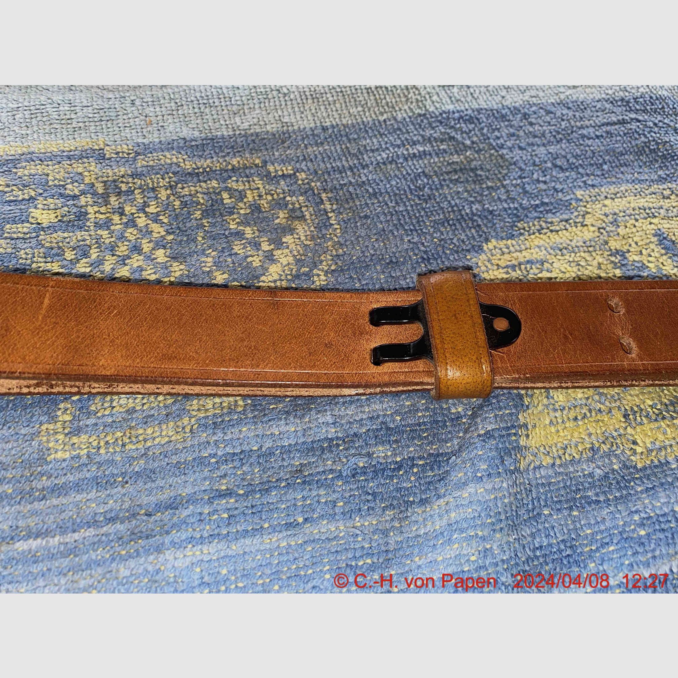 Rifle sling with strap buckle