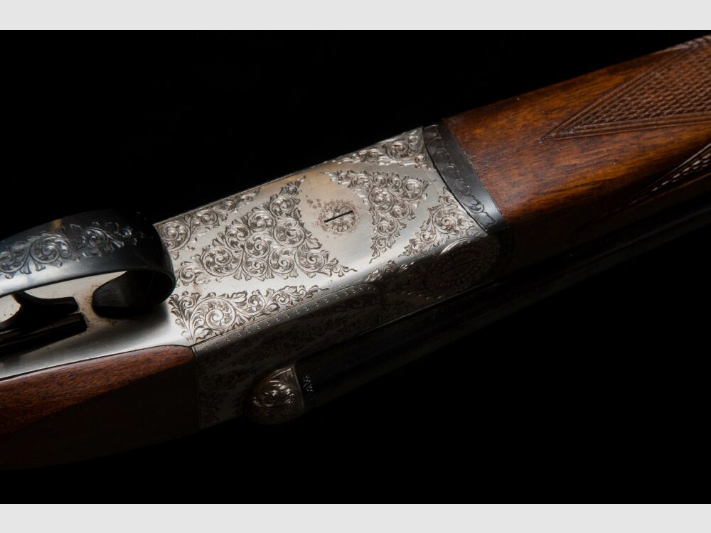 elegante Doppelflinte mit umfassender Gravur