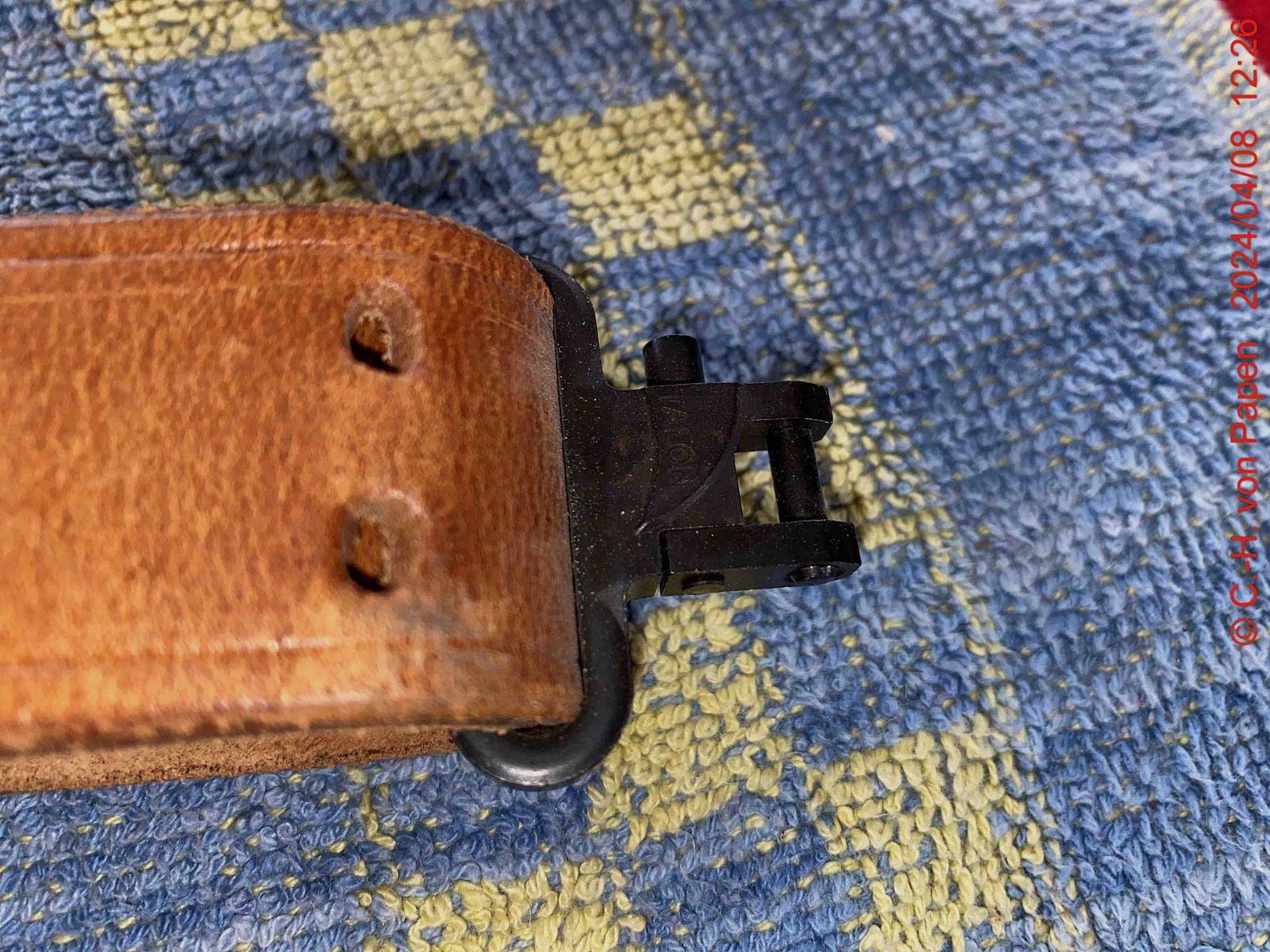 Rifle sling with strap buckle