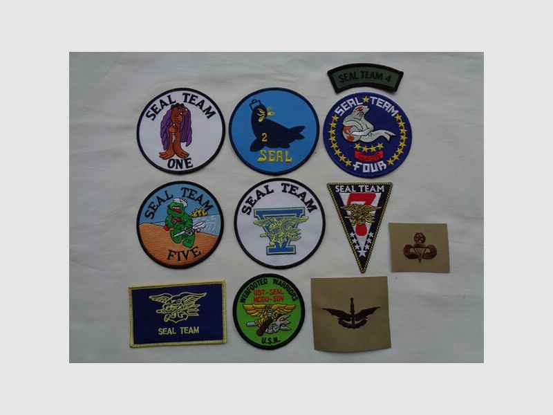 Sammlung orig. US-NAVY SEAL Abzeichen, 11 Teile, neu (NOS)