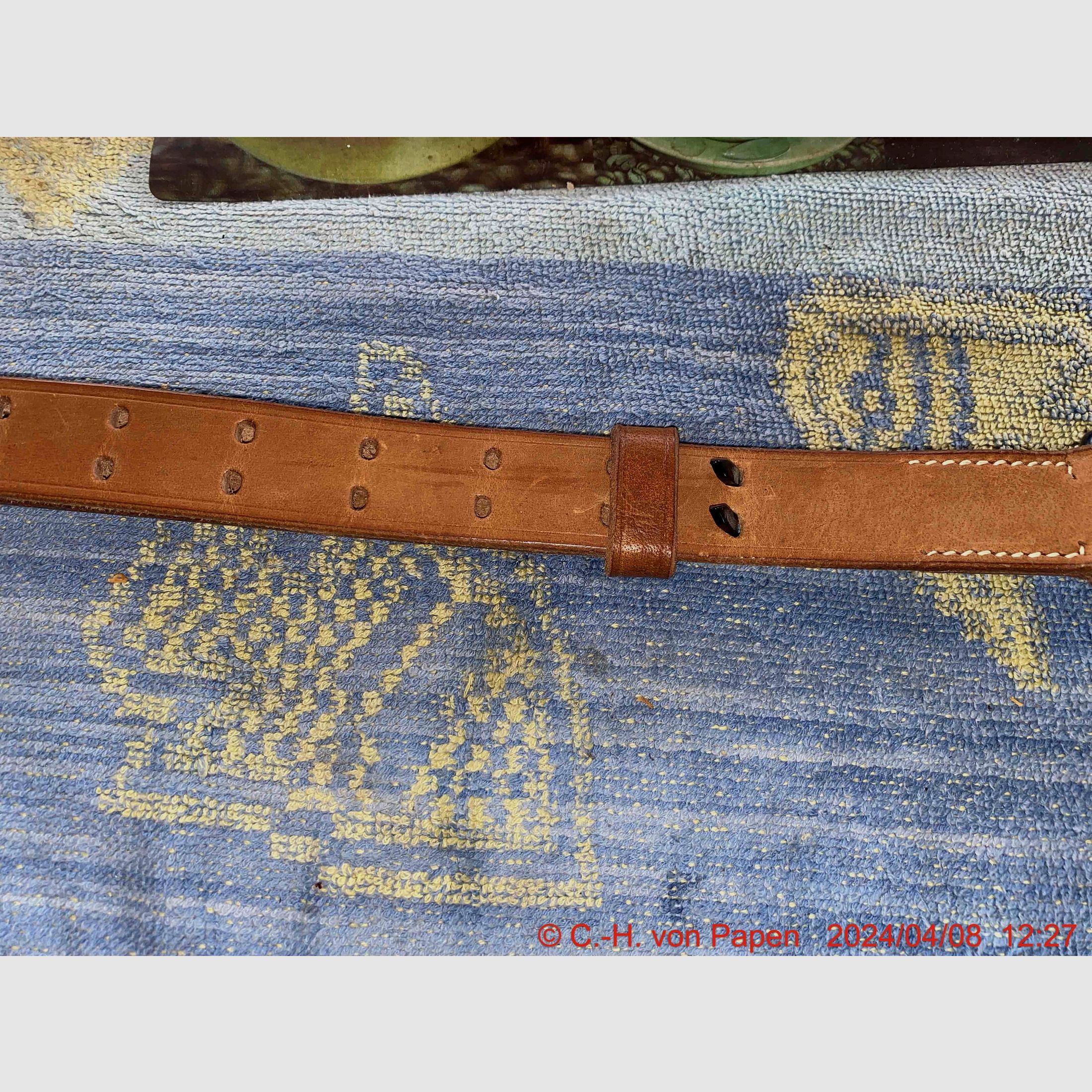 Rifle sling with strap buckle