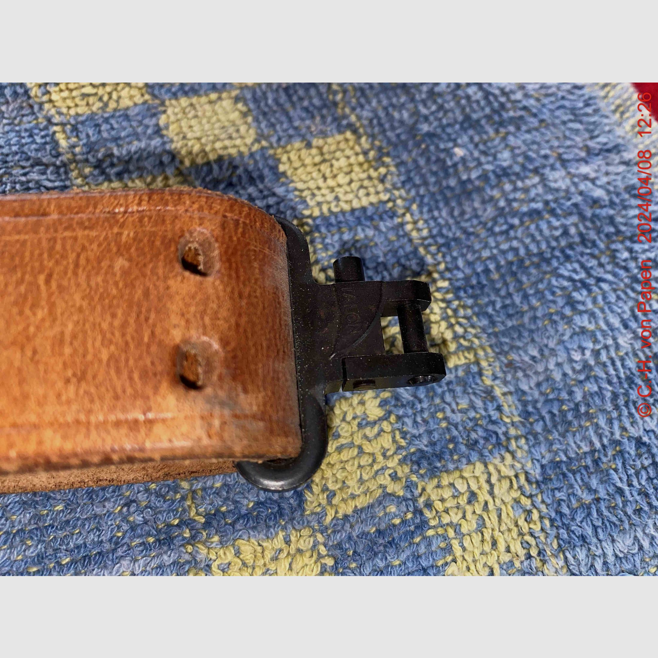 Rifle sling with strap buckle