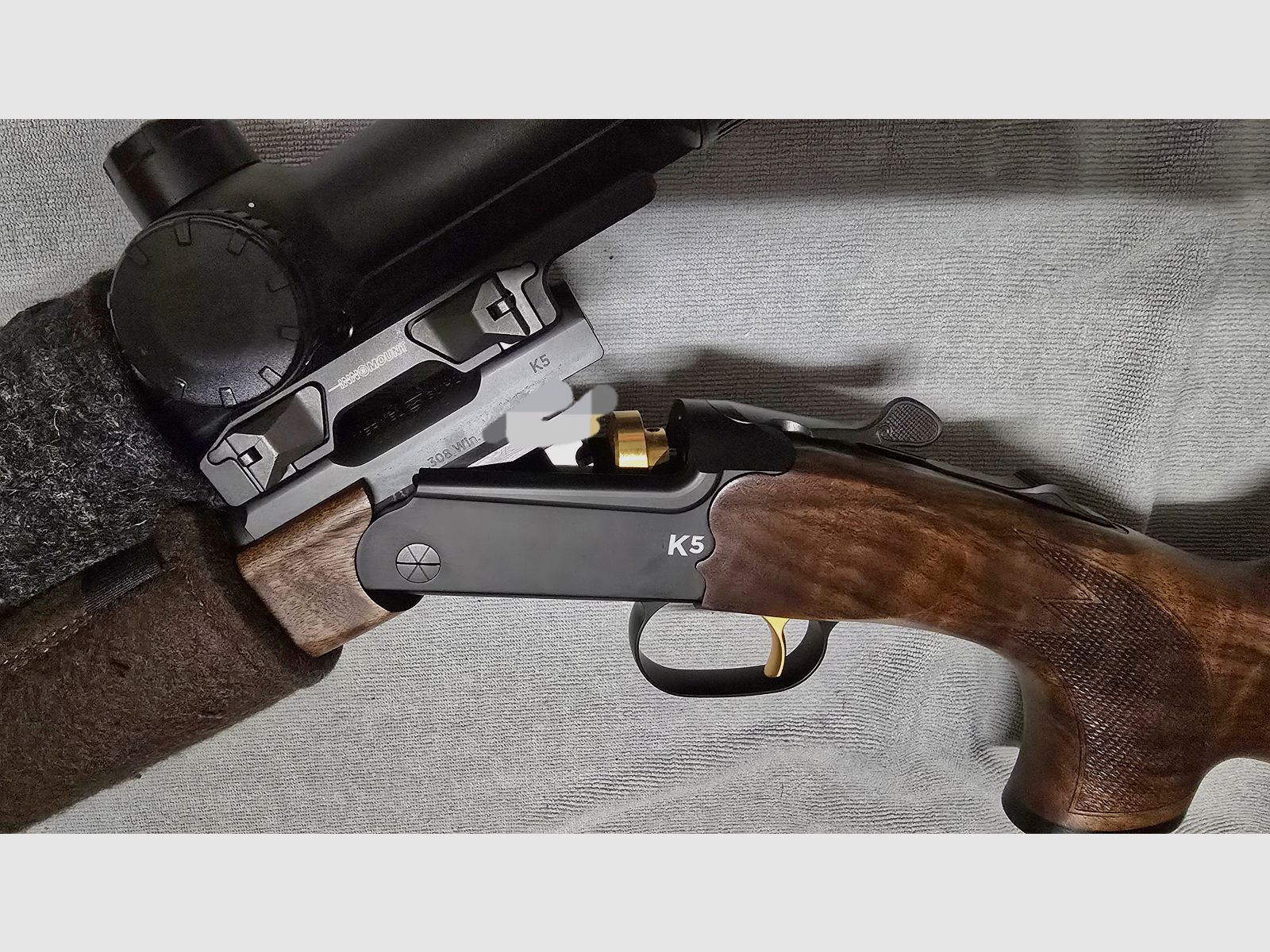 Merkel K5 Extrem with ZEISS V8 1.8-14x50 riflescope with rail and VANWARD Hunter PRO, overbarrel titanium suppressor for caliber .30