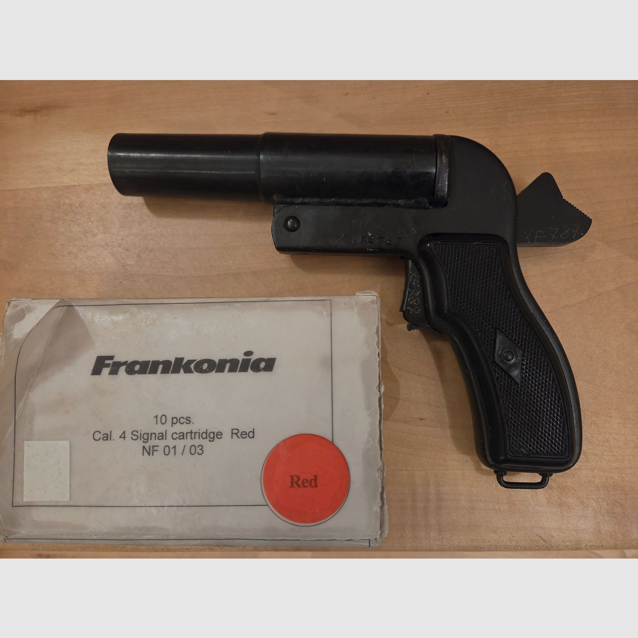 Flare gun with red signal ammunition