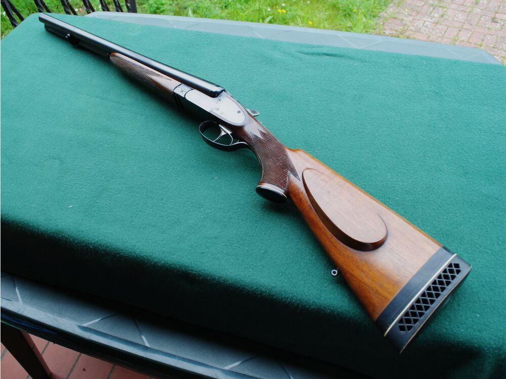 CAS escopeta de caza, auténticos cerrojos laterales, sin extractores, seguro manual.