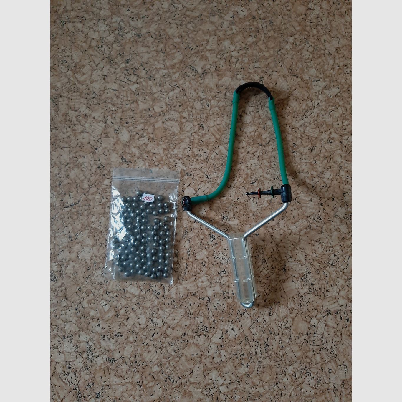 Slingshot with 100 steel balls