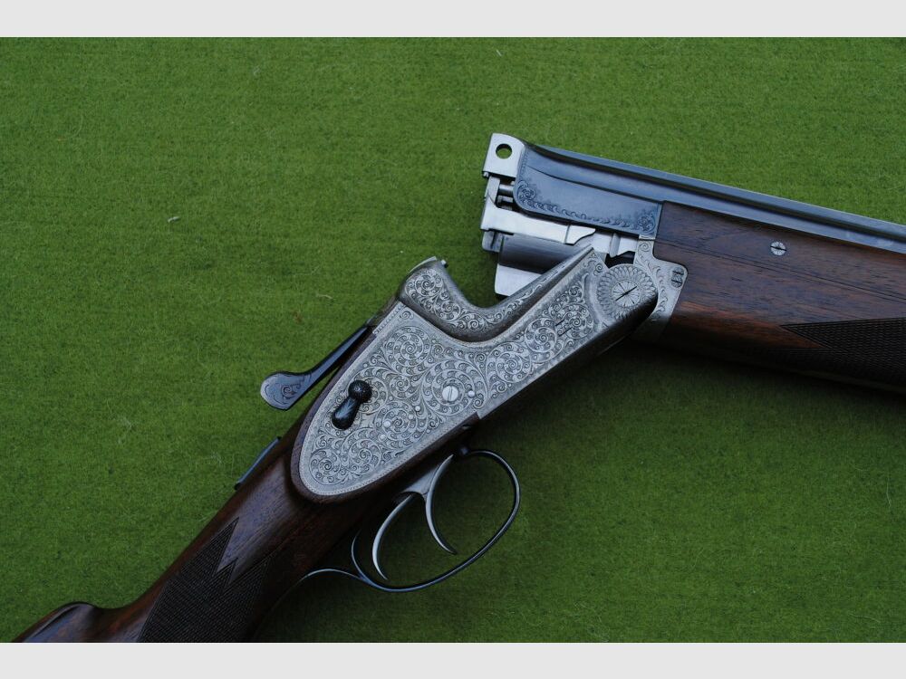 hand-engraved Merkel side lock double barrel shotgun, model 203E