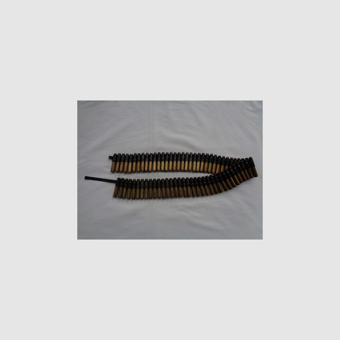 US MG Gurt .30-06 auf M1 Gurtgliedern, 69 Hülsen + Gurtlader, 50er Jahre, s.g. Zustand