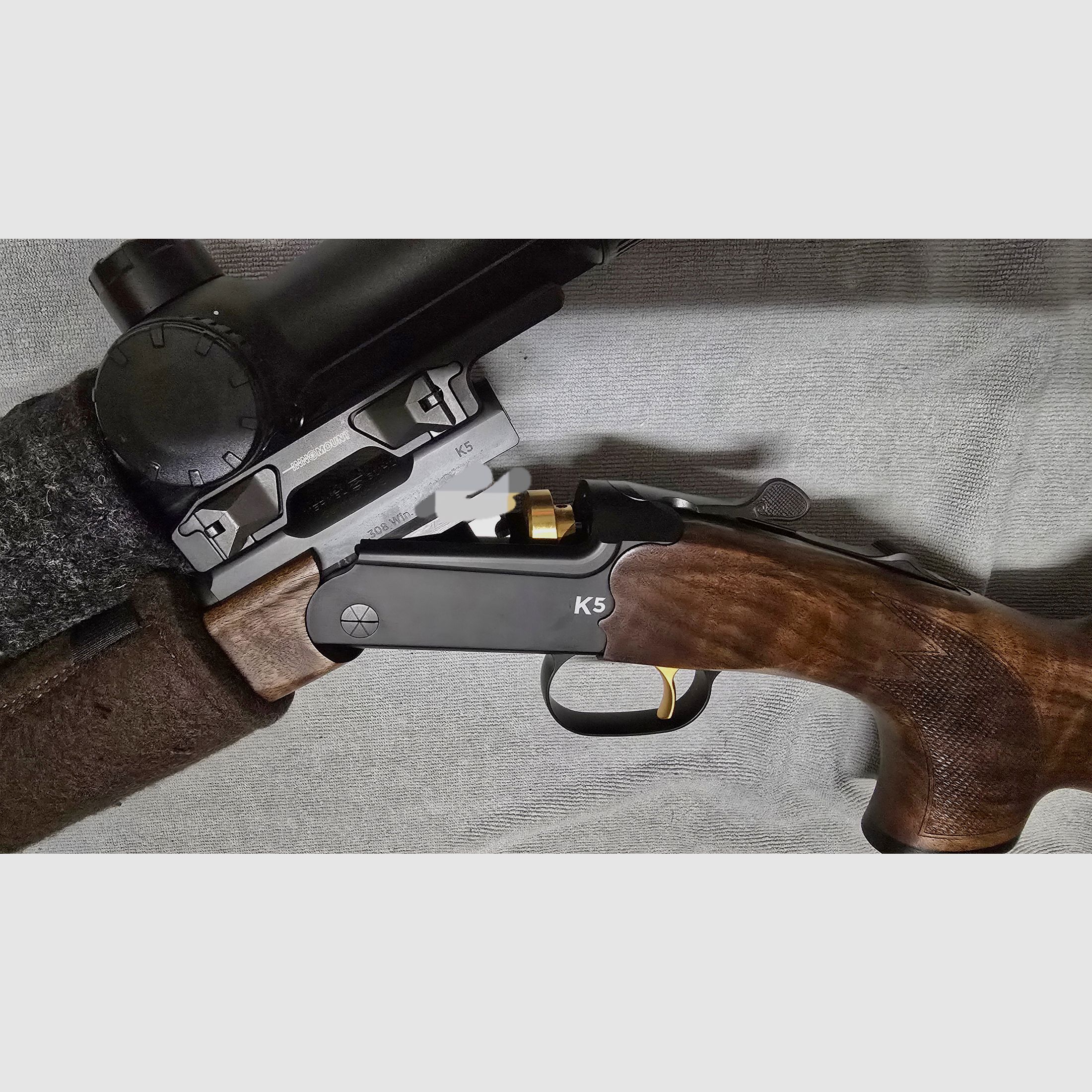 Merkel K5 Extrem with ZEISS V8 1.8-14x50 riflescope with rail and VANWARD Hunter PRO, overbarrel titanium suppressor for caliber .30