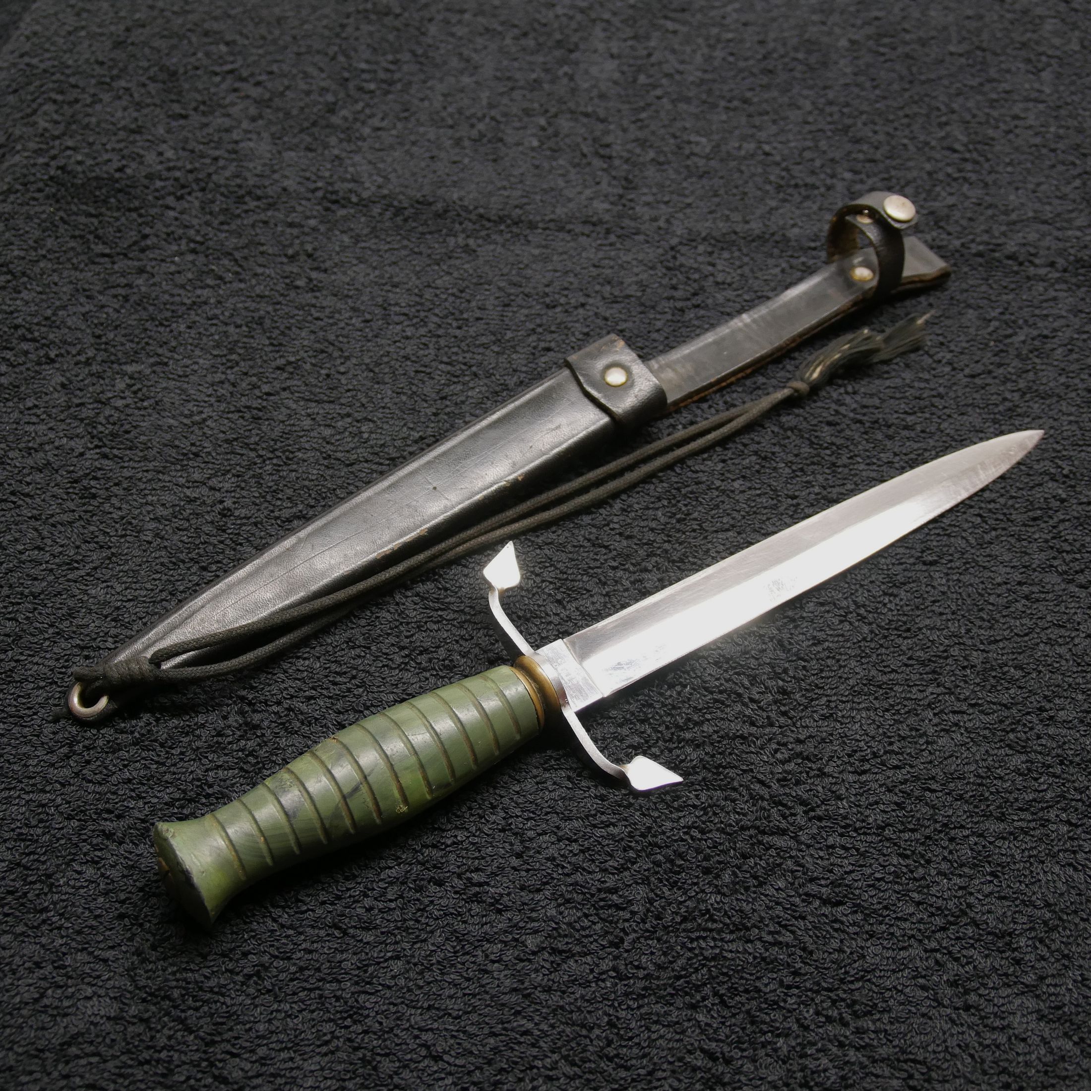 Dagger in leather sheath green handle age unknown