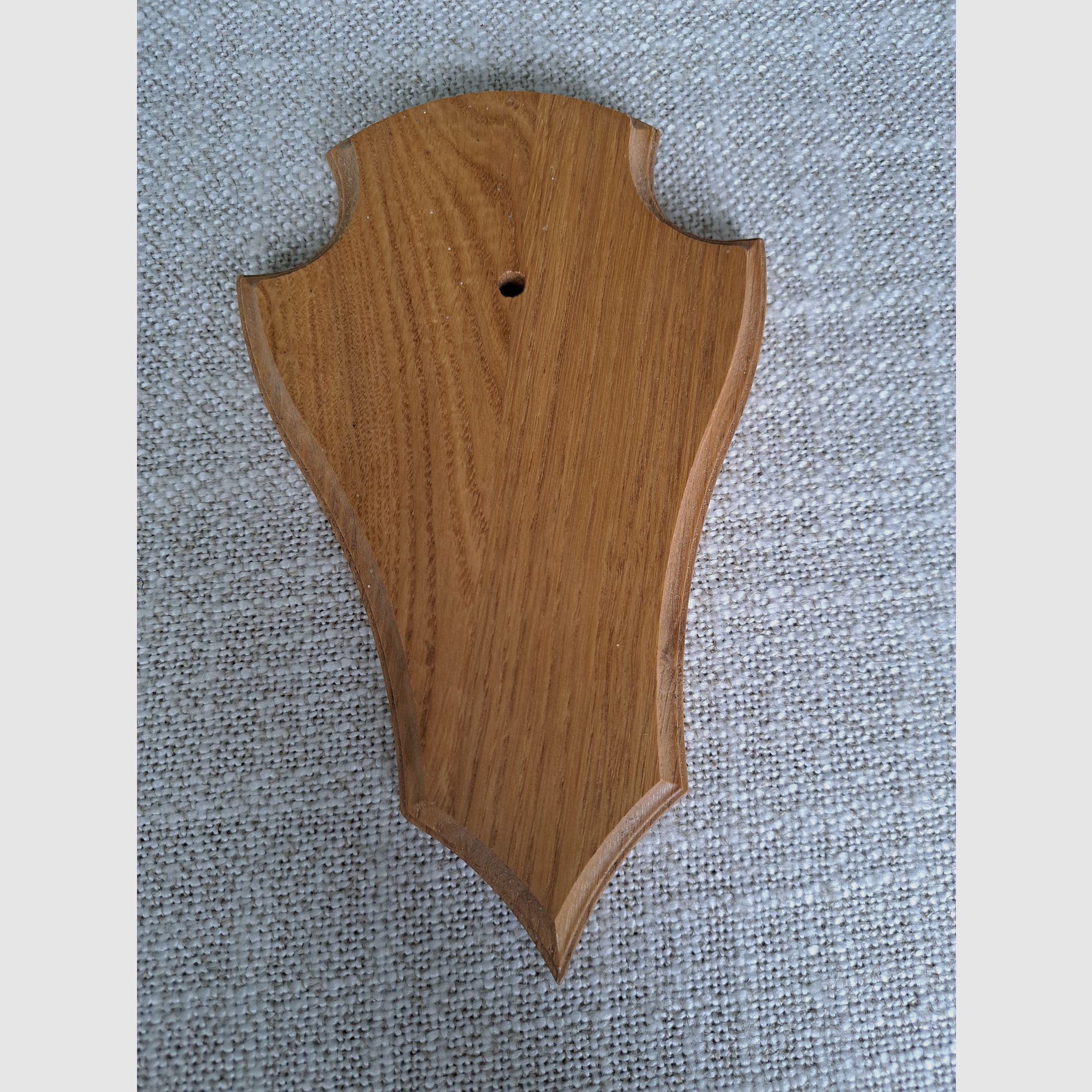 For sale: nearly new horn shield made of light oak.