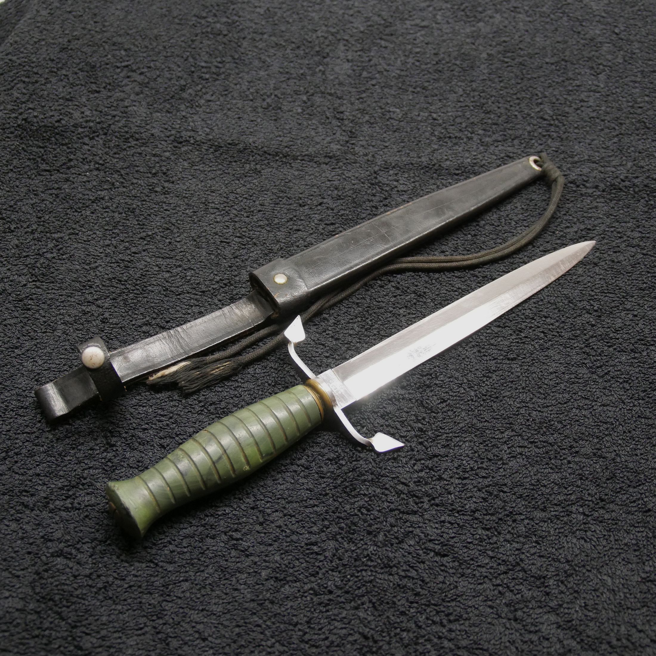 Dagger in leather sheath green handle age unknown